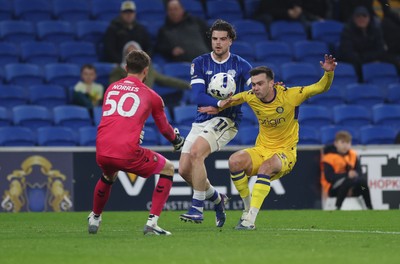 170326 - Cardiff `City v Wycombe Wanderers, EFL Sky Bet League 1 - Daniel Harvie of Wycombe Wanderers and Ollie Tanner of Cardiff City compete for the ball as Wycombe Wanderers goalkeeper Will Norris closes in