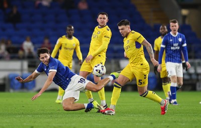 170326 - Cardiff `City v Wycombe Wanderers, EFL Sky Bet League 1 - Rubin Colwill of Cardiff City competes with Caolan Boyd-Munce of Wycombe Wanderers and Aaron Morley of Wycombe Wanderers for the ball