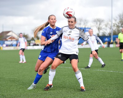 140424 - Cardiff City Women v Swansea City Women - Genero Adran Trophy Final - Rhianne Oakley of Cardiff City Women is challenged by Robyn Pinder of Swansea City Women