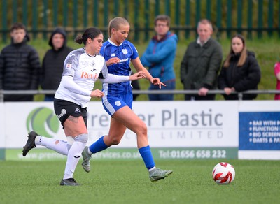 140424 - Cardiff City Women v Swansea City Women - Genero Adran Trophy Final - Rhianne Oakley of Cardiff City Women is challenged by Jess Williams of Swansea City Women