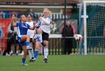 140424 - Cardiff City Women v Swansea City Women - Genero Adran Trophy Final - Ellie Lake of Swansea City Women is challenged by Seren Watkins of Cardiff City Women