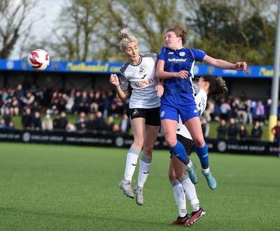 140424 - Cardiff City Women v Swansea City Women - Genero Adran Trophy Final - Lucy Finch of Swansea City Women is challenged by Mikayla Cook of Cardiff City Women