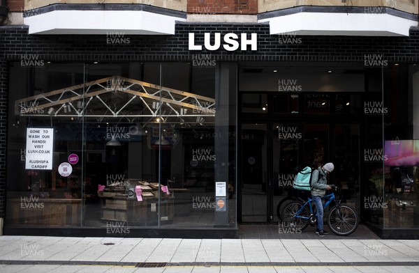 040321 - Picture shows a deliveroo rider outside Lush on Queens Street, Cardiff today as the current coronavirus restrictions are set to stay in place