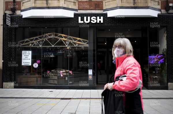 040321 - Picture shows a woman outside Lush on Queens Street, Cardiff today as the current coronavirus restrictions are set to stay in place