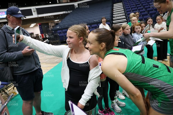 240525 - Cardiff Dragons v Loughborough Lightning - Netball Super League - Vicky Booth of Cardiff Dragons with fans