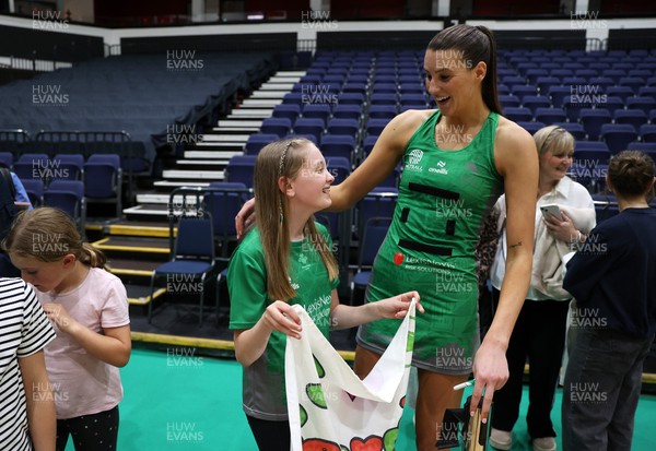 240525 - Cardiff Dragons v Loughborough Lightning - Netball Super League - Georgia Rowe of Cardiff Dragons with fans