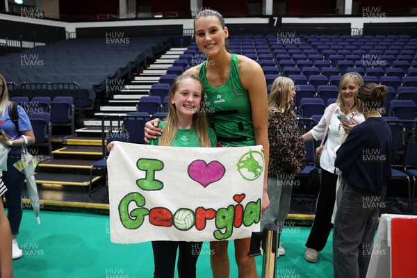 240525 - Cardiff Dragons v Loughborough Lightning - Netball Super League - Georgia Rowe of Cardiff Dragons with fans