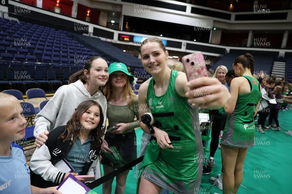 240525 - Cardiff Dragons v Loughborough Lightning - Netball Super League - Chelsea Beard of Cardiff Dragons with fans