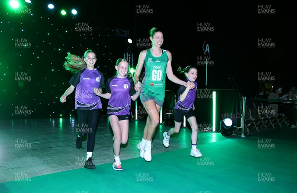 240525 - Cardiff Dragons v Loughborough Lightning - Netball Super League - Jacqui Newton of Cardiff Dragons with mascots