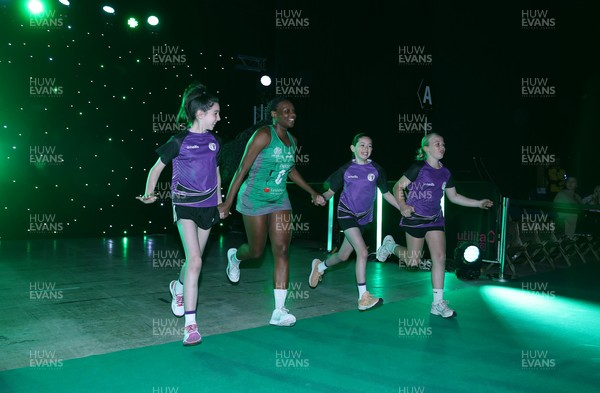 240525 - Cardiff Dragons v Loughborough Lightning - Netball Super League - Khanyisa Chawane of Cardiff Dragons with mascots