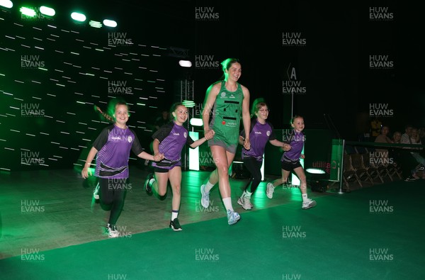 240525 - Cardiff Dragons v Loughborough Lightning - Netball Super League - Chelsea Beard of Cardiff Dragons with mascots
