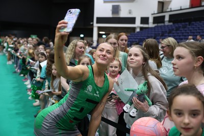 050425 - Cardiff Dragons v Manchester Thunder - Netball Super League - Phillipa Yarranton of Cardiff Dragons with fans