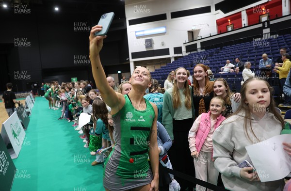 050425 - Cardiff Dragons v Manchester Thunder - Netball Super League - Phillipa Yarranton of Cardiff Dragons with fans