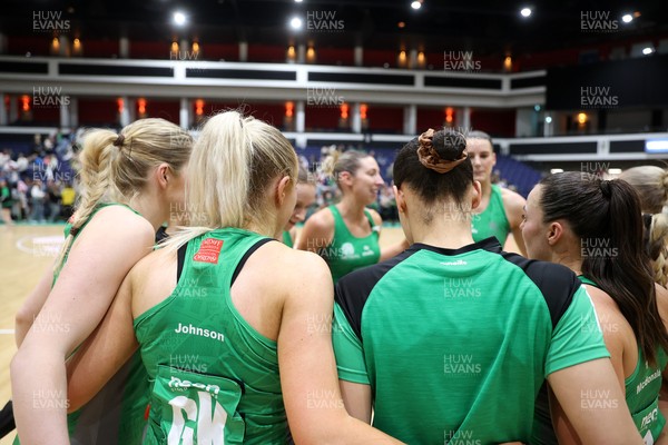 050425 - Cardiff Dragons v Manchester Thunder - Netball Super League - Team huddle