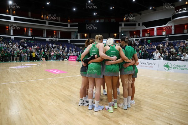050425 - Cardiff Dragons v Manchester Thunder - Netball Super League - Team huddle