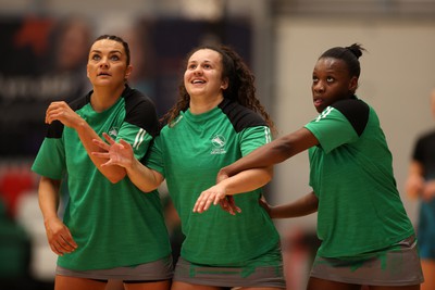 190424 - Cardiff Dragons v Surrey Storms - Vitality Netball Super League - Nia Jones, Beth Ecuyer-Dale and Khanyisa Chawane of Cardiff Dragons