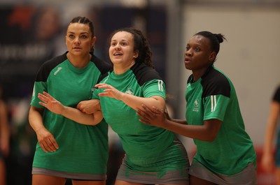 190424 - Cardiff Dragons v Surrey Storms - Vitality Netball Super League - Nia Jones, Beth Ecuyer-Dale and Khanyisa Chawane of Cardiff Dragons