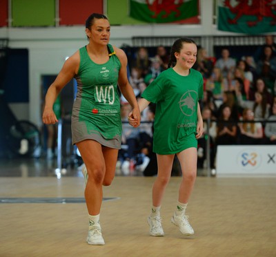 190424 - Cardiff Dragons v Surrey Storm - Vitality Netball SuperLeague - Nia Jones of Cardiff Dragons walking out with the mascot