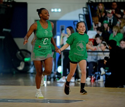 190424 - Cardiff Dragons v Surrey Storm - Vitality Netball SuperLeague - Khanyisa Chawane of Cardiff Dragons walking out with the mascot