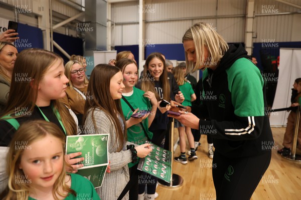 190424 - Cardiff Dragons v Surrey Storms - Vitality Netball Super League - Millie Carter of Cardiff Dragons with fans 