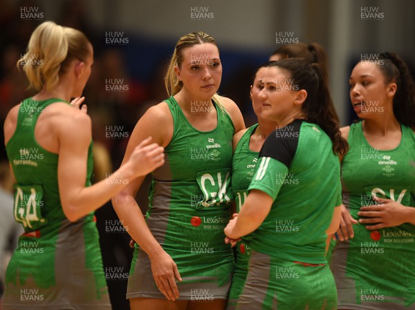 190424 - Cardiff Dragons v Surrey Storm - Vitality Netball SuperLeague - Leah Middleton of Cardiff Dragons with team mates at the end of the game