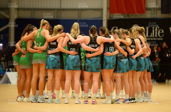 190424 - Cardiff Dragons v Surrey Storm - Vitality Netball SuperLeague - Cardiff Dragons and Surrey Storm huddle together at the end of the game