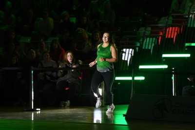 220225 - Cardiff Dragons v Birmingham Panthers - Netball Super League - Beth Ecuyer-Dale of Cardiff Dragons runs out for the start of the match