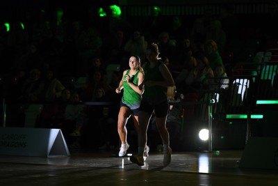 220225 - Cardiff Dragons v Birmingham Panthers - Netball Super League - Alex Johnson of Cardiff Dragons runs out for the start of the match