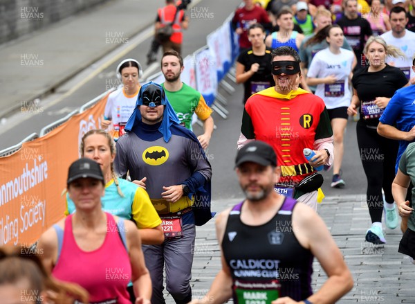011023 - Principality Building Society Cardiff Half Marathon 2023 - Runners dressed as Batman and Robin