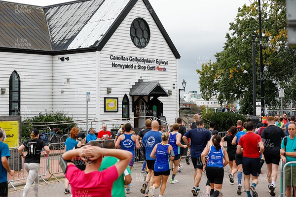 011023 - Principality Building Society Cardiff Half Marathon 2023 - Cardiff Bay - Runners pass Norwegian Church