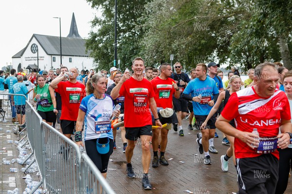 011023 - Principality Building Society Cardiff Half Marathon 2023 - Cardiff Bay - Runners pass Norwegian Church