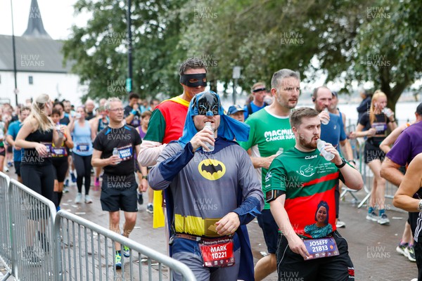011023 - Principality Building Society Cardiff Half Marathon 2023 - Cardiff Bay - Runners dressed as Batman and Robin