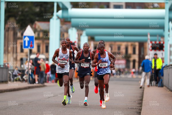 011023 - Principality Building Society Cardiff Half Marathon 2023 - Leaders of the men's race, Shadrack Kimining, Benard Biwott and Vincent Mutai, with Geoffrey Keogh and Wesley Kimutai behind, at the Cardiff Barrage