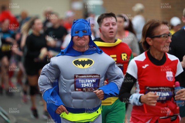 011023 - Principality Building Society Cardiff Half Marathon 2023 - Runner dressed as Batman at the Cardiff Barrage