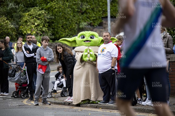 011023 - Principality Building Society Cardiff Half Marathon 2023 - Roath Park and Lake - Spectator dressed as Baby Yoda