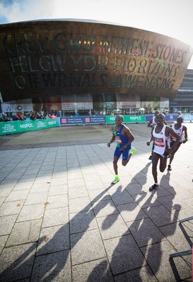 061019 - Cardiff Half Marathon 2019 - The race leaders make their way through Cardiff Bay, Roald Dahl Plas and past the Wales Millennium Centre at the halfway point of the race