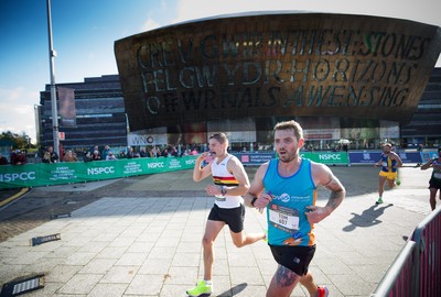 061019 - Cardiff Half Marathon 2019 - Runners make their way through Cardiff Bay, Roald Dahl Plas and past the Wales Millennium Centre at the halfway point of the race