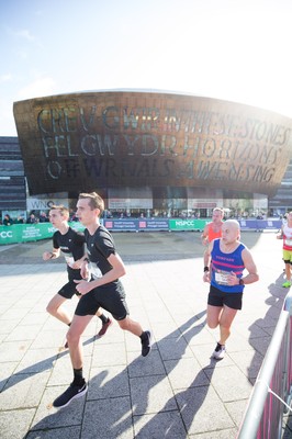 061019 - Cardiff Half Marathon 2019 - Runners make their way through Cardiff Bay, Roald Dahl Plas and past the Wales Millennium Centre at the halfway point of the race