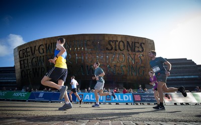 061019 - Cardiff Half Marathon 2019 - Runners make their way through Cardiff Bay, Roald Dahl Plas and past the Wales Millennium Centre at the halfway point of the race