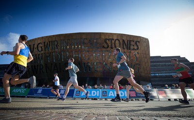 061019 - Cardiff Half Marathon 2019 - Runners make their way through Cardiff Bay, Roald Dahl Plas and past the Wales Millennium Centre at the halfway point of the race