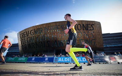 061019 - Cardiff Half Marathon 2019 - Runners make their way through Cardiff Bay, Roald Dahl Plas and past the Wales Millennium Centre at the halfway point of the race