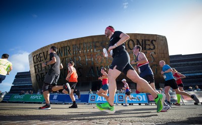 061019 - Cardiff Half Marathon 2019 - Runners make their way through Cardiff Bay, Roald Dahl Plas and past the Wales Millennium Centre at the halfway point of the race