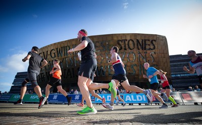 061019 - Cardiff Half Marathon 2019 - Runners make their way through Cardiff Bay, Roald Dahl Plas and past the Wales Millennium Centre at the halfway point of the race