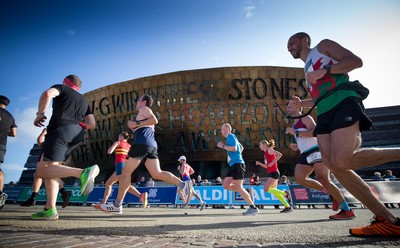 061019 - Cardiff Half Marathon 2019 - Runners make their way through Cardiff Bay, Roald Dahl Plas and past the Wales Millennium Centre at the halfway point of the race