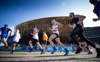 061019 - Cardiff Half Marathon 2019 - Runners make their way through Cardiff Bay, Roald Dahl Plas and past the Wales Millennium Centre at the halfway point of the race