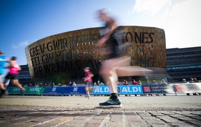 061019 - Cardiff Half Marathon 2019 - Runners make their way through Cardiff Bay, Roald Dahl Plas and past the Wales Millennium Centre at the halfway point of the race