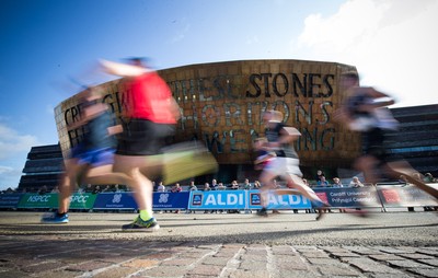 061019 - Cardiff Half Marathon 2019 - Runners make their way through Cardiff Bay, Roald Dahl Plas and past the Wales Millennium Centre at the halfway point of the race