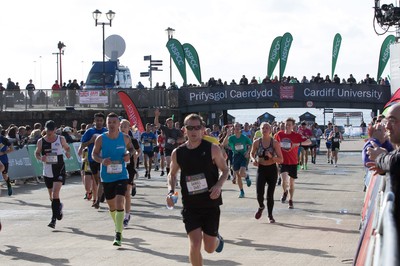 061019 - Cardiff Half Marathon 2019 - Runners make their way through Cardiff Bay, Roald Dahl Plas and past the Wales Millennium Centre at the halfway point of the race