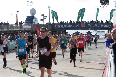 061019 - Cardiff Half Marathon 2019 - Runners make their way through Cardiff Bay, Roald Dahl Plas and past the Wales Millennium Centre at the halfway point of the race