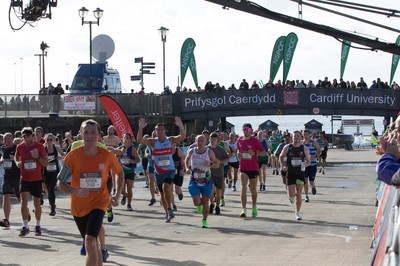 061019 - Cardiff Half Marathon 2019 - Runners make their way through Cardiff Bay, Roald Dahl Plas and past the Wales Millennium Centre at the halfway point of the race